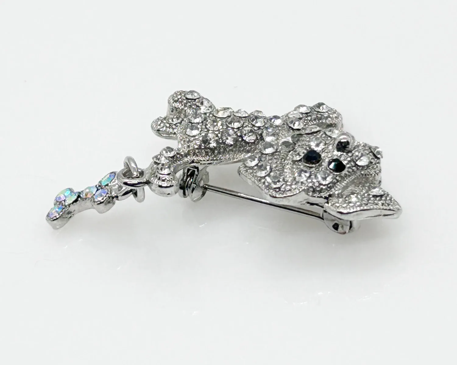 Tiny Whimsical Dog with a Bone Brooch