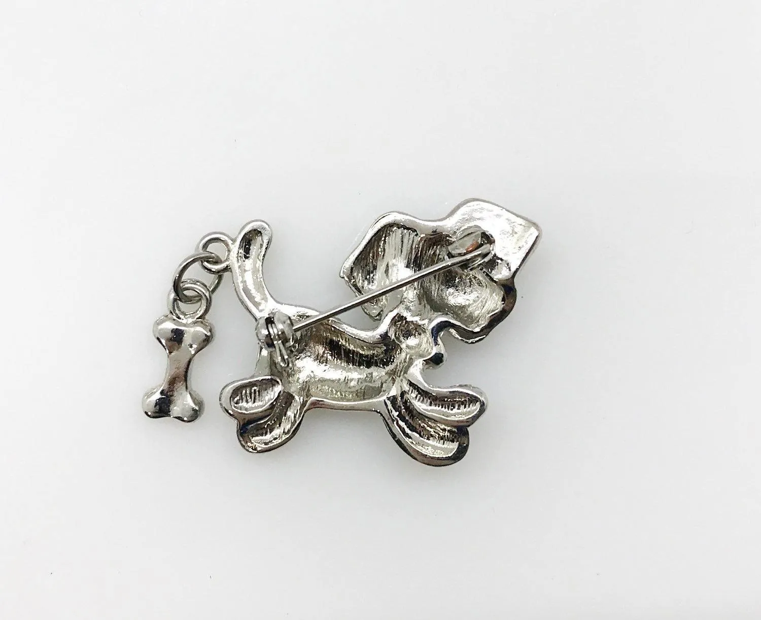 Tiny Whimsical Dog with a Bone Brooch